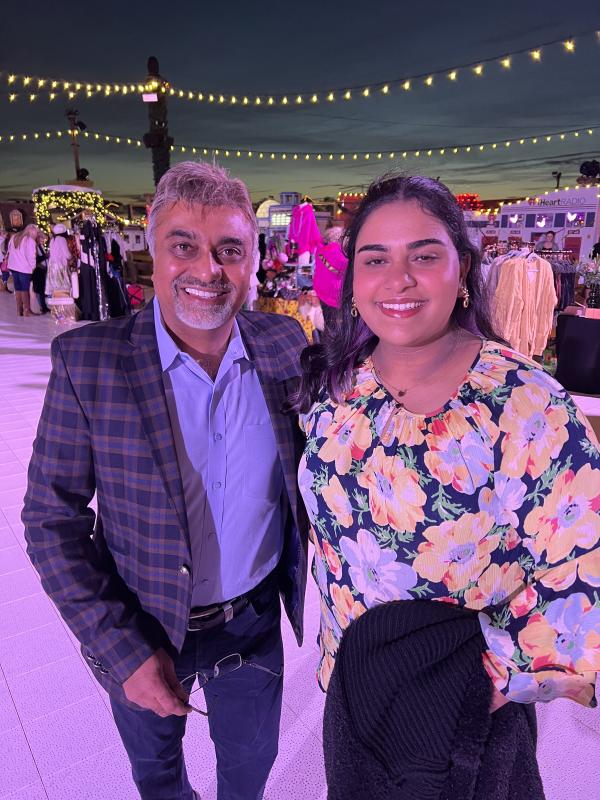 Harry Keswani and his daughter Anjali enjoy the evening at Schellville. Harry K has been working to defeat childhood hunger in Delaware through his foundation.