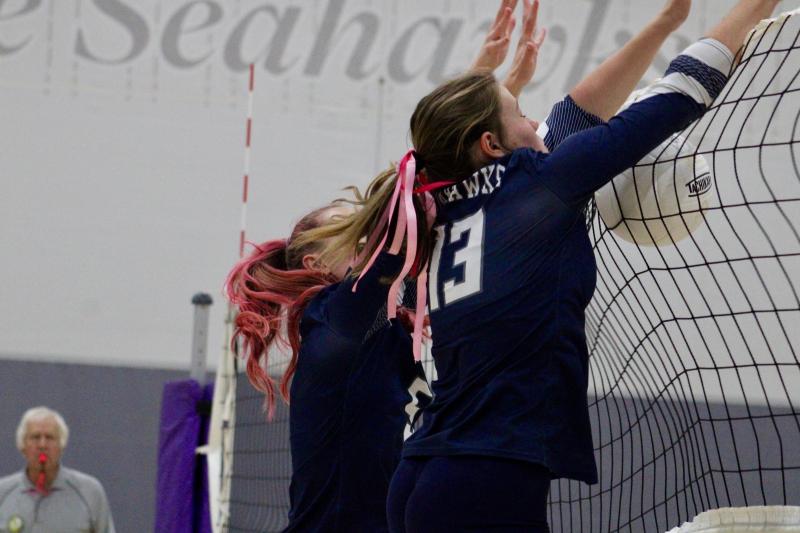 Seahawks senior Carmen Merrick teams up with freshman Grayce Glover for a block. Merrick became Sussex Academy’s all-time leader in blocks during the match.
