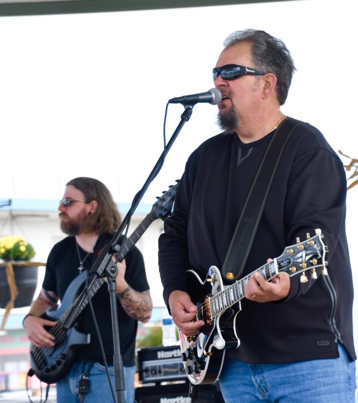 Sticky Situation performs at The Bandstand as part of the long list of Sea Witch entertainment. Doing vocals and playing guitars are Paul Webb, right, and Bob Clifton. RON MACARTHUR PHOTO