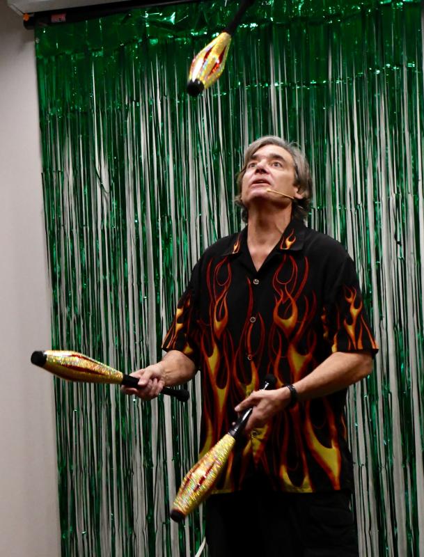 Cascading Carlos Mir entertains young and old alike as he keeps three juggling pins in the air in the children’s entertainment area at the Rehoboth Beach Convention Center. RON MACARTHUR PHOTO