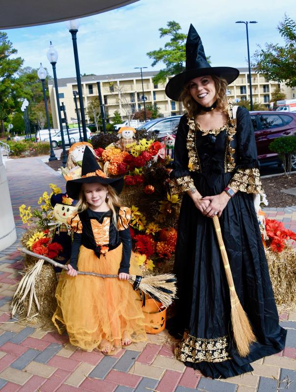 Not all witches are scary. Summer, left, and Ami Jachimski of Bishopville, Md., are dressed as fancy witches. RON MACARTHUR PHOTO
