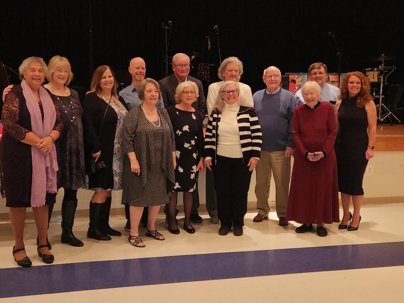 Primeros Pasos Board President Jeffrey Ross joins Executive Director Casey Christophel in recognizing past and current board members for their dedication and hard work. Shown are in back (l-r) Maria Joseph, Cheryl Fruchtman, Tina Schaeffer, Todd Brown, Dave Baker, Barbara Tenney, Joe Conaway, Jeffrey Ross and Casey Christophel. In front are Sally Beamont, Sandy Baker, Anne Canan and Mary Lou Tietz. SUBMITTED PHOTO