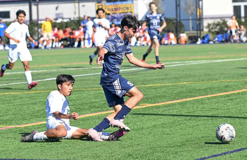 Sussex Academy junior McKenna Danahy controls the ball despite the tackle by Central’s Diego Ramirez-Lopez.