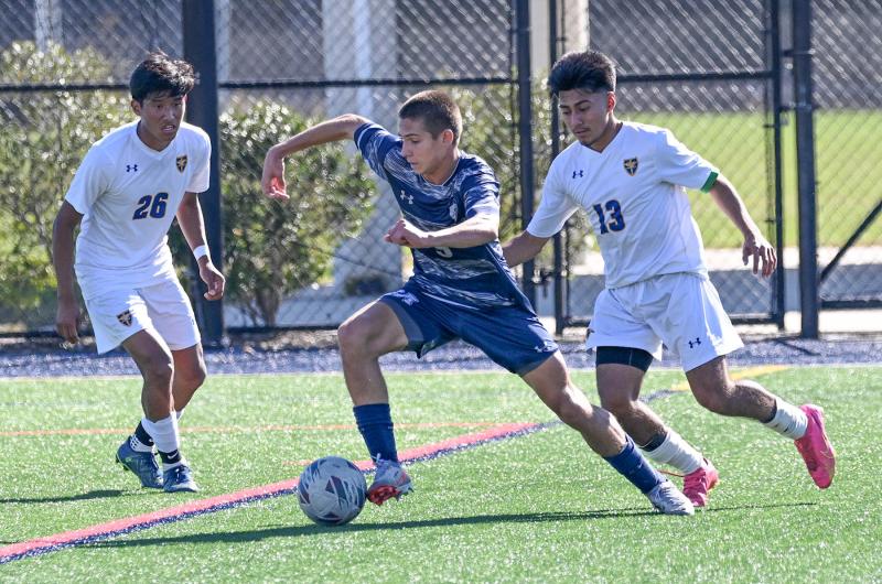 Sussex Academy’s George Sapna controls the ball between Central’s Gamadiel Velasquez Hernandez, left, and Alvin Perez Perez.
