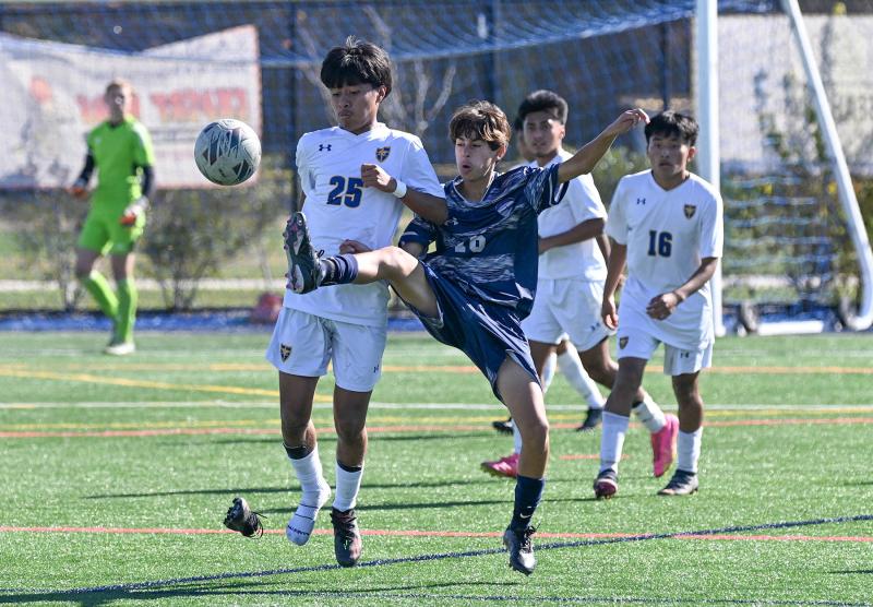 Seahawks eighth-grader Bohdi Williams powers the ball out of the shoes of Central’s Frank Perez Romero.