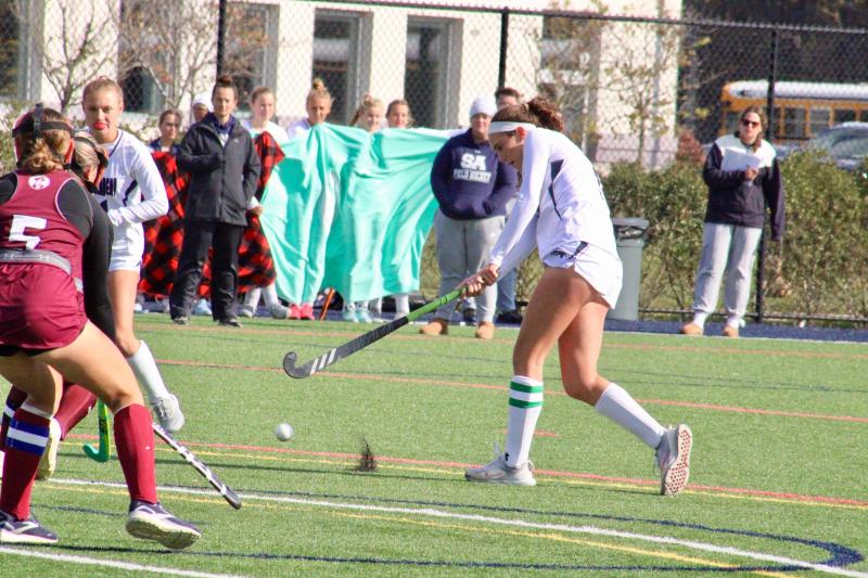 Sussex Academy junior Shelby Manlove blasts a shot form the edge of the shooting circle for one of her goals.