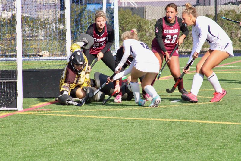 Seahawks junior Julie Daniello gets a shot past a diving Concord goalie to close out the second quarter 6-0.