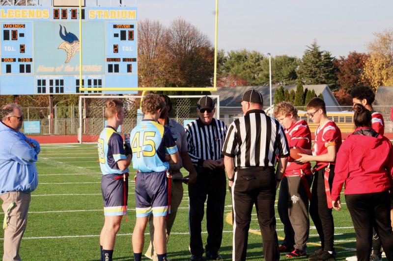 Cape captains senior Tony Palmer and junior Luke Pickard meet with Smyrna’s captain at midfield for the coin toss and introduction from the officials before their quarterfinal game Nov. 16 at Legends Stadium.