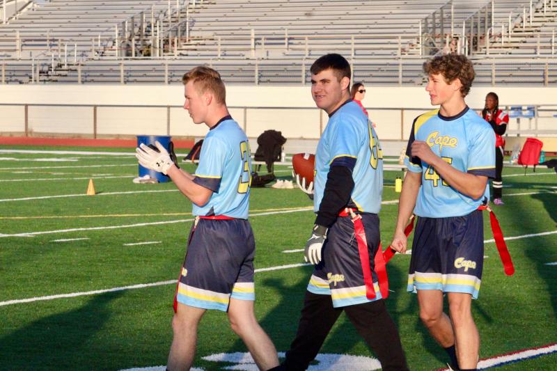 Cape junior Randolph Adams, middle, celebrates a one-point conversion. He is congratulated by Tony Palmer, left, and Luke Pickard.