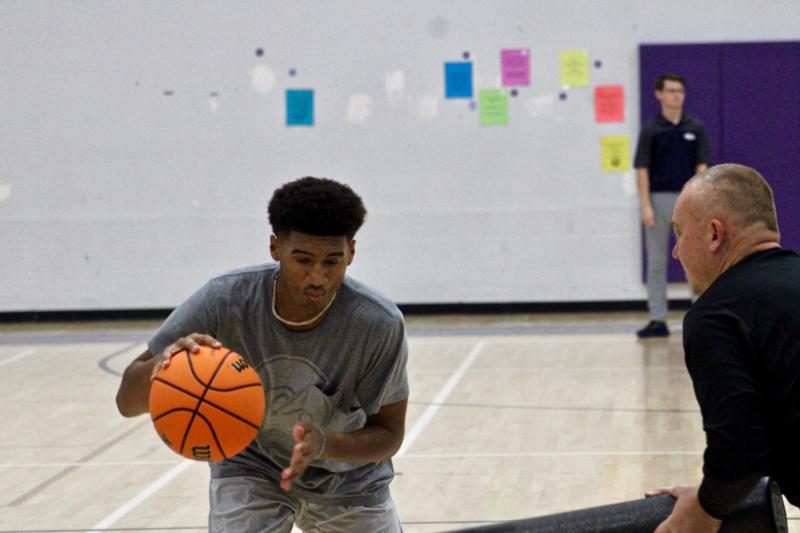 Sussex Academy junior Jahmari Davis shields the ball during his dribble. Davis also plays lacrosse and the two sports require similar skill sets.