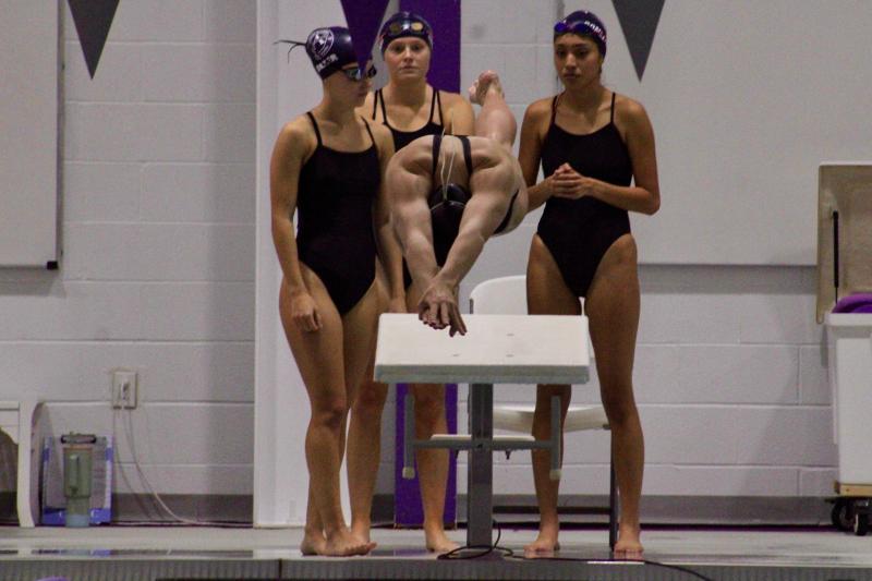Seahawks senior Gracie Maughan jumps in for the 200 freestyle relay, an event she won with her teammates (l-r) Lyla Baker, Addison McKay and Itzel Gomez-Sanchez.