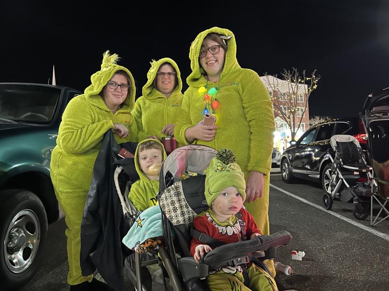 A family of Grinches on the avenue. Shown in back are (l-r) Leslie Sweetman, Jennifer Gibbs and Kaitlin Gibbs. Jake and Walter Sweetman are watching the fun from the stroller.