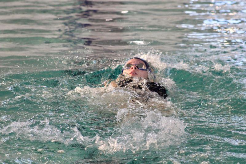 Seahawks sophomore Victoria Evans does the backstroke on her way to a first-place finish in the 200 individual medley.
