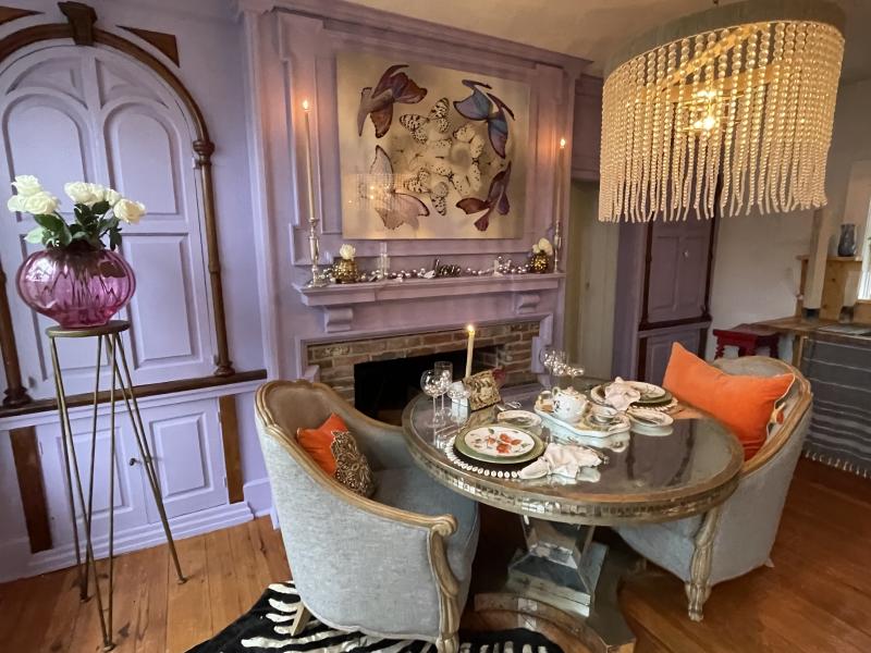 A uniquely decorated dining area designed by Sanctuary Interior Designs is highlighted at 219 Grey Plover Court.