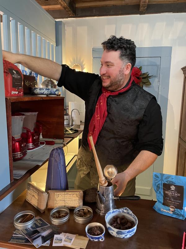 Marcos Salaverria, LHS director of education, serves coffee in the society’s coffee shop. He has a special love for the beans because his family in El Salvador owns a coffee plantation, El Rodeo.
