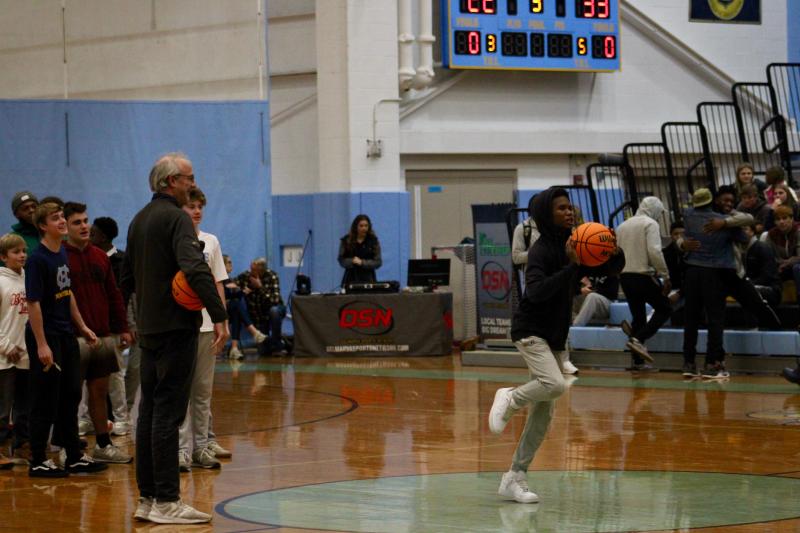 During halftime, spectators could pay $1 for a chance to win a free large pizza from Grotto. While this young man was just a bit off, two participants did earn a free pie.
