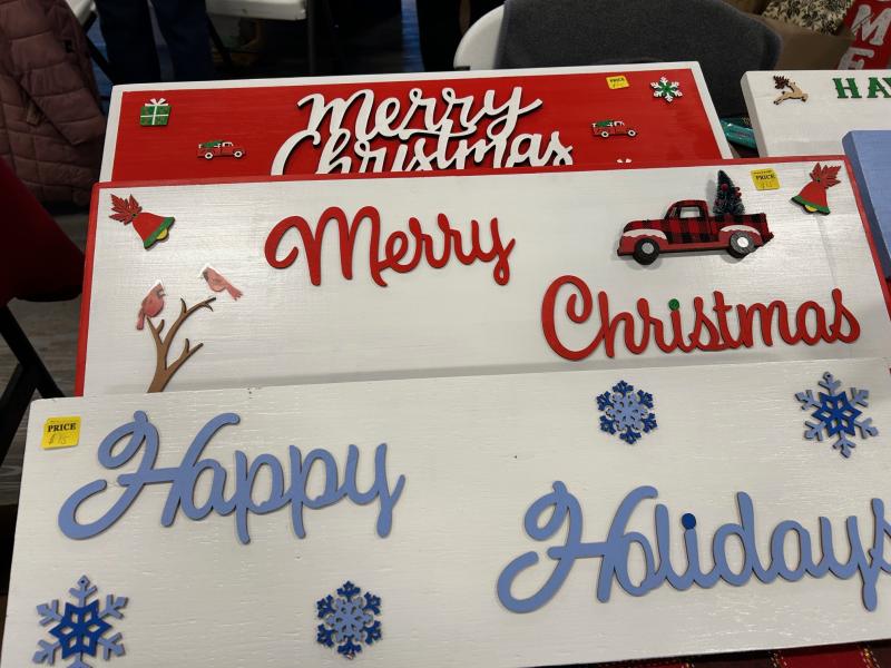 The Holly Festival had customers covered when it came to Christmas decorations, including handmade wooden signs.