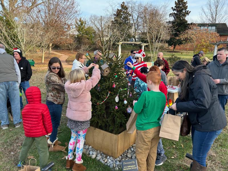Students put ornaments on the H.O. Brittingham Elementary School tree.
