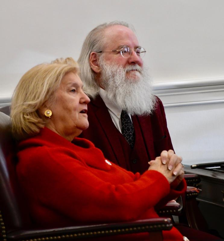 Defense attorney Jane Brady listens with her client Kris Kringle to the evidence brought against him.