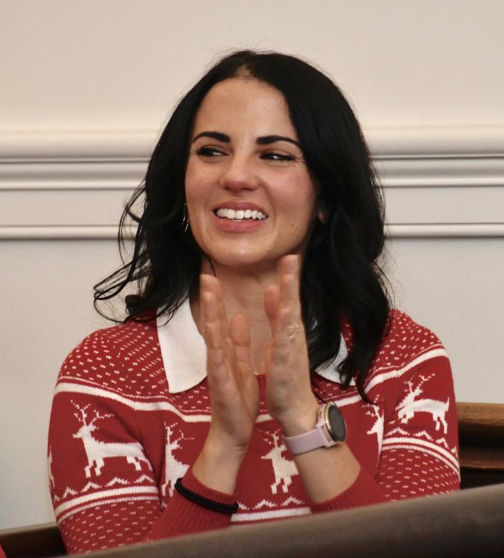 Love Creek Elementary School teacher Michelle Karsnitz, daughter of the judge, claps after the verdict is rendered.