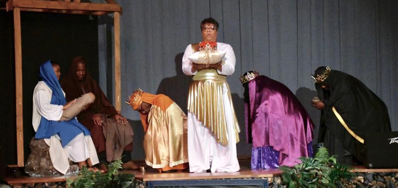 With the crown being carried by Chantea Harmon, the three wise men visit the manger where baby Jesus was born.