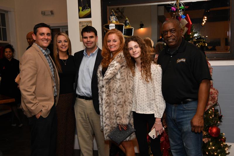 Local Sydney’s patrons (l-r) Chris and Courtney Conley and Jeff, Molly and Lainey Chorman get their picture with co-owner Anthony Lewis.