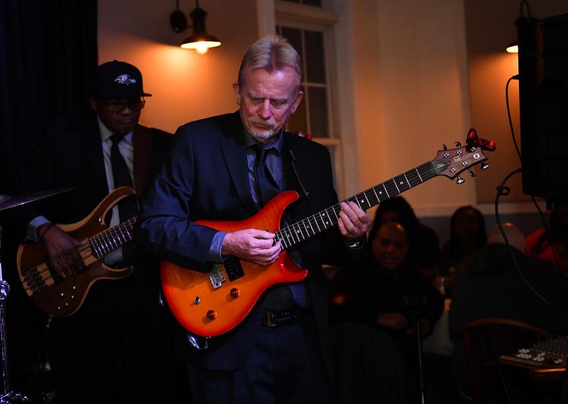 Comfort Zone guitarist Howard Wimbrow plays a solo.