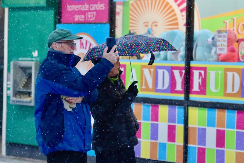Joe and Mary Barrett from Scranton, Pa., stopped to take a selfie in the snow. They said there was more snow in Rehoboth Beach Jan. 15 than at their Pennsylvania home. BILL SHULL PHOTO