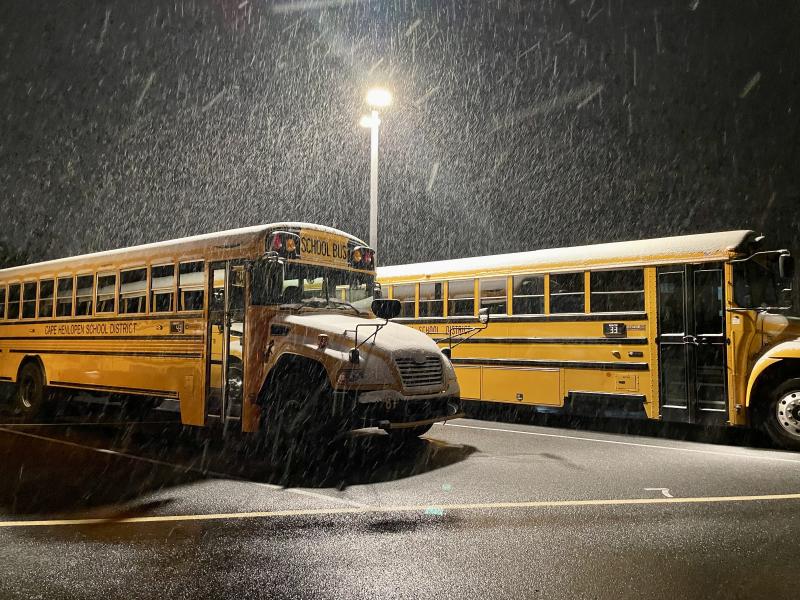School-aged kids are hoping the snow continues as it falls on buses parked in the Lewes Elementary School parking lot. RON MACARTHUR PHOTO