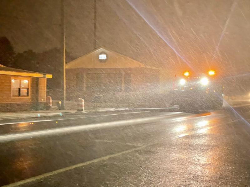 A Delaware Department of Transportation puts down some ice melt on Savannah Road in Lewes, RON MACARTHUR PHOTO