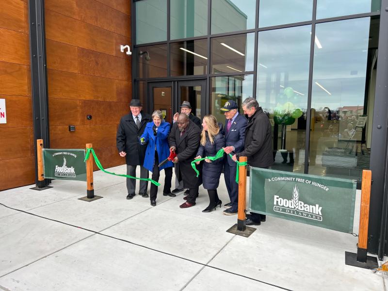Food Bank of Delaware cut the ribbon on its new 70,000-square-foot facility in Milford Jan. 15. Taking part in the ribbon cutting are (l-r) Sen. Dave Wilson, R-Bridgeville; Food Bank President and CEO Cathy Kanefsky; Jody Sweeney, Kent County Levy Court; Frank Coverdale; State Treasurer Colleen Davis; U.S. Sen. Tom Carper; and Bill Thompson. RYAN MAVITY PHOTOS