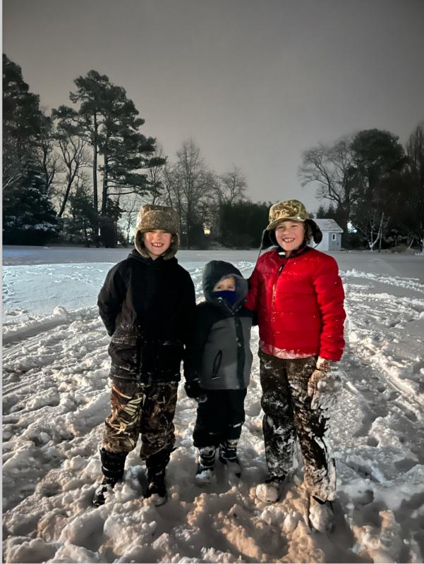 Milo Flowers, Bentley Jackson and Owen Jackson enjoy the snowy weather in this photo by Heather Flowers.