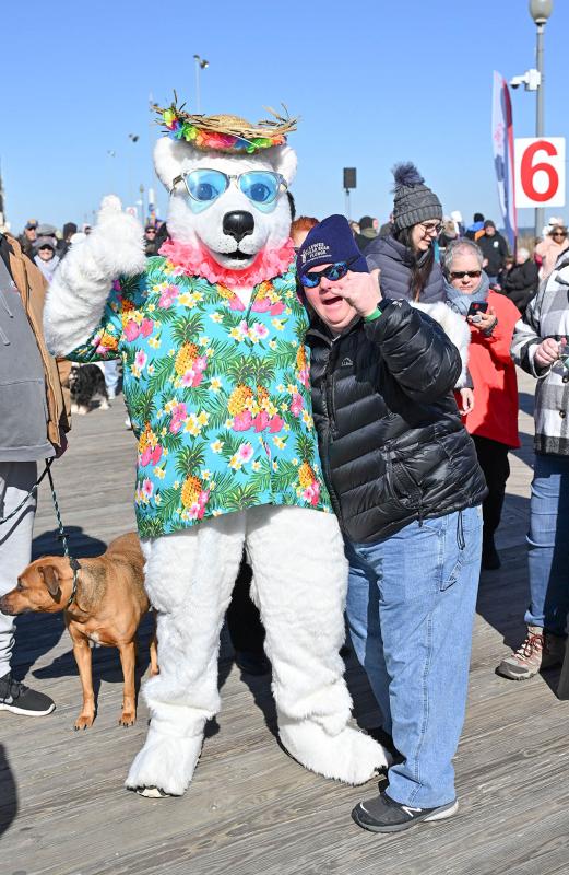 SODE Hall of Famer and weightlifting champion Jon Stoklosa gets a hug from a Polar Bear before the plunge.