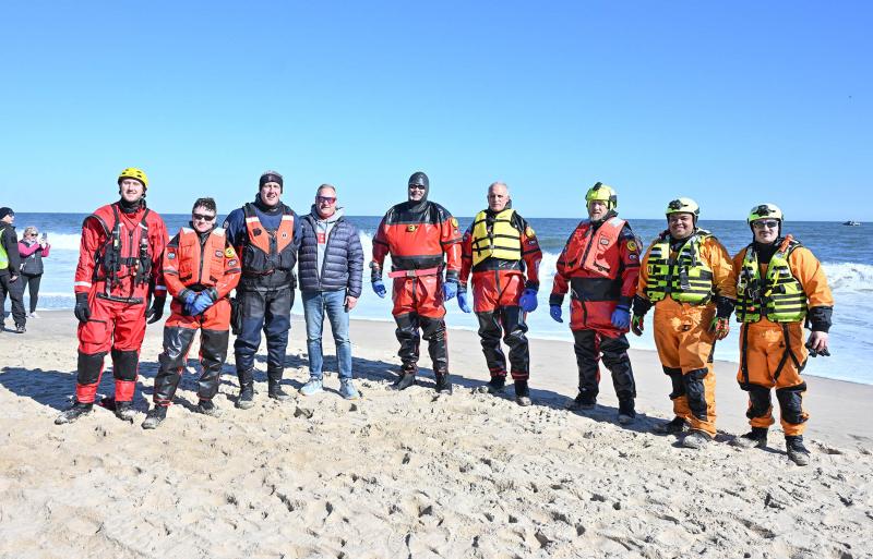 Rehoboth Beach Patrol captain Captain Jeffrey Giles (third from left) and the dive team gets prepared to keep the Polar Bears safe.