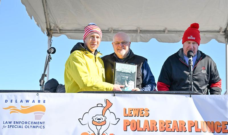 Receiving a plaque of appreciation from Special Olympics Delaware President David Halley, left, is Greg Nolt, state director, Delaware Law Enforcement for Special Olympics.