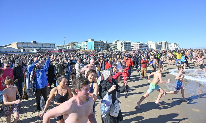 A record 4,388 Polar Bears run to the chilly Atlantic Ocean during the 33rd annual Lewes Polar Bear Plunge to benefit Special Olympics Delaware.