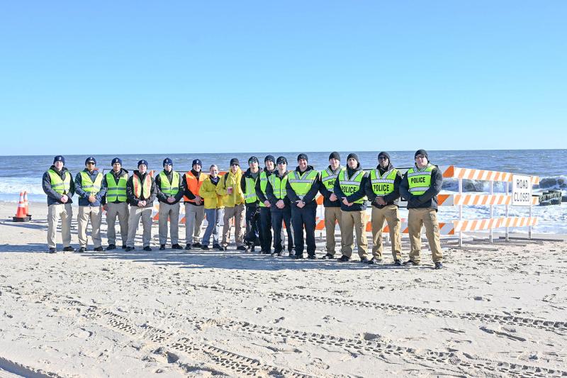 Officers from the Delaware State Police, and Dover and New Castle County police departments assist in putting up barriers for the safety of the Polar Bears.