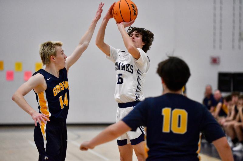 Seahawks sophomore Nate Elliott rises just before he is fouled. Elliott played through a knee injury suffered in the first quarter.