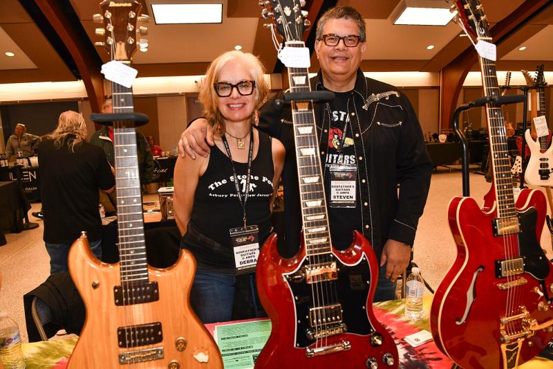 Debra and Steven DiVenuta of Godfather’s Guitars and Amps display their Gibson and Epiphone guitars.