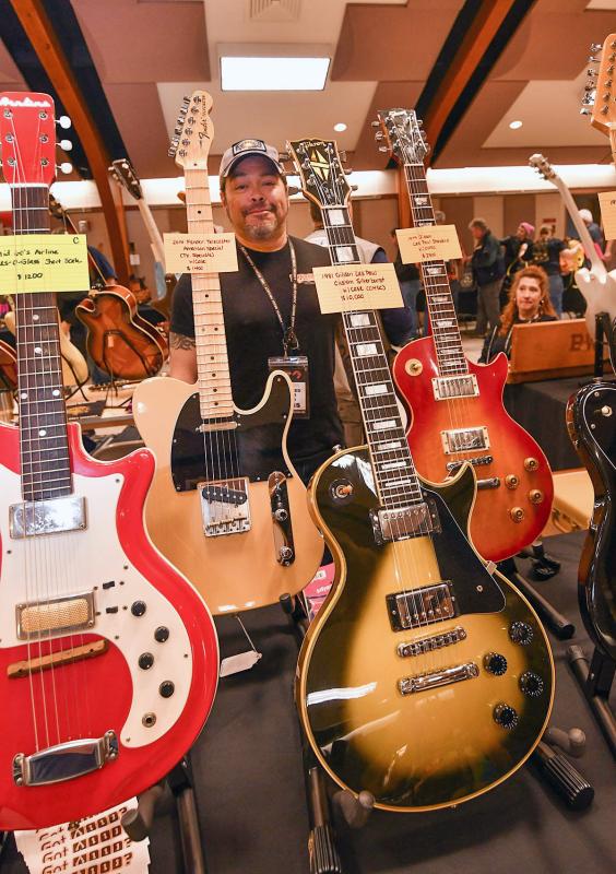 Chris DellaPorta of Woodshed Guitar Works displays his 2014 Fender Telecaster and his 1981 Gibson Les Paul.