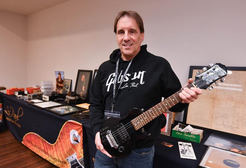 Jim Wysocki, a friend of the famous Les Paul, holds a gift made by Les Paul for the birth of Wysocki’s daughter.