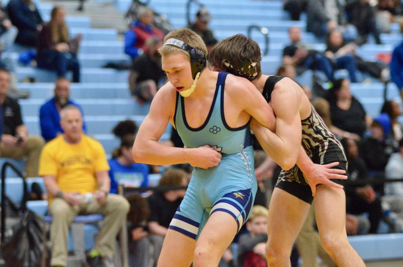 Vikings junior Max Meadows tries to escape from Appoquinimink’s Jordan Mills in the seventh-place match of the 132-pound bracket.