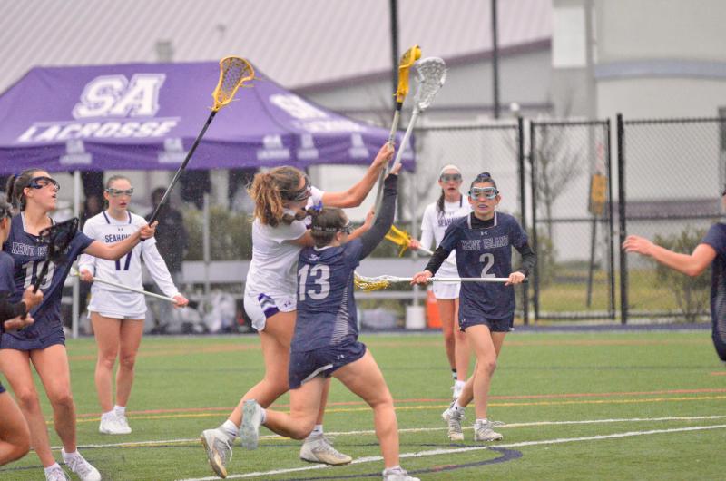 Seahawks junior Emiley Bisaha leaves a trail of Bucs in her wake as she scores one of her six goals.