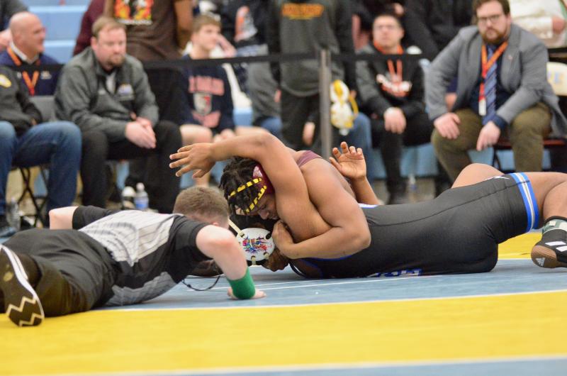 Milford’s Greg Lockett pinned Wilmington Charter’s Brandon King with 18 seconds to go in the first period to claim third place in the 215-pound weight class.