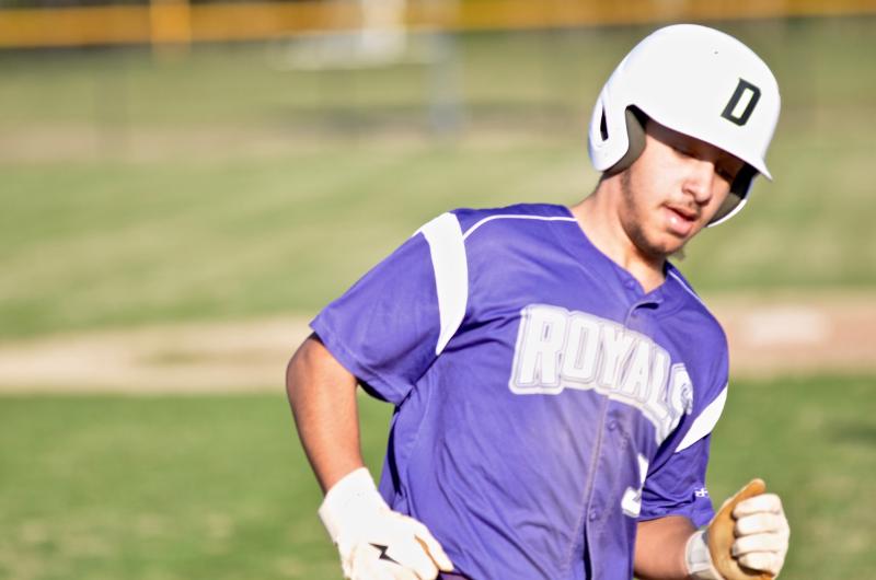 Royals senior Xavier Efford rounds third to score one of his three runs in the March 12 scrimmage against Sts. Peter & Paul.