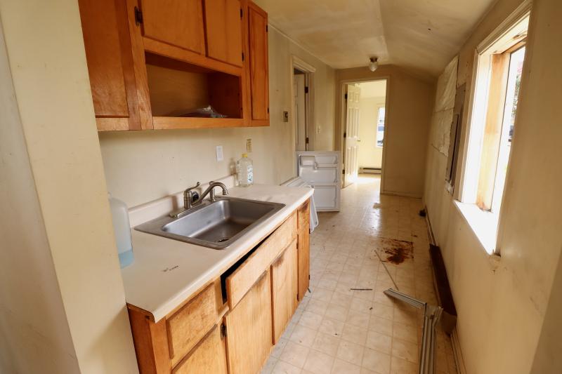 The kitchen inside 331 Chestnut St. The Daiseys showed evidence of rotting window frames and crumbling walls that they said made the house impossible to save.