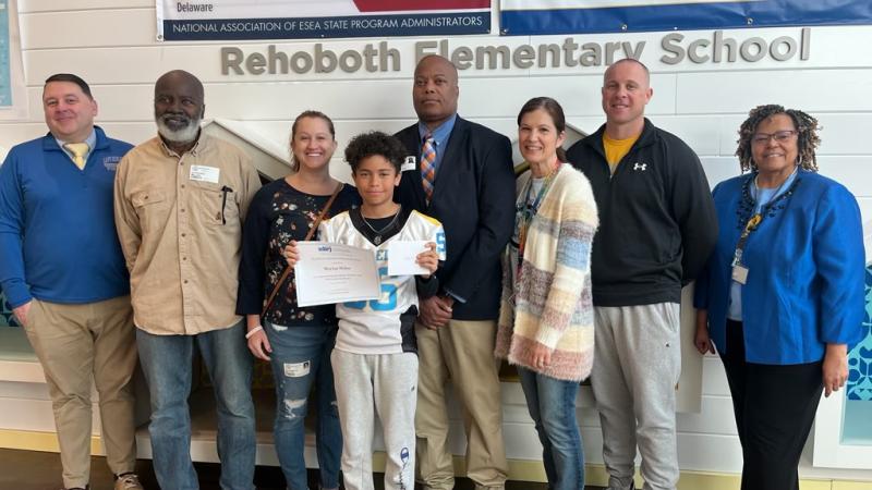 Rehoboth Elementary fifth-grader MJ Miller was recently recognized by the Southern Delaware Alliance for Racial Justice. Gathered are (l-r) Assistant Principal Kevin Monaghan, Alphonso Miller, Elizabeth Miller, MJ Miller, Marlon Miller Sr., Renee Kosc, Richard Lantz and Principal Doris Person. SUBMITTED PHOTOS