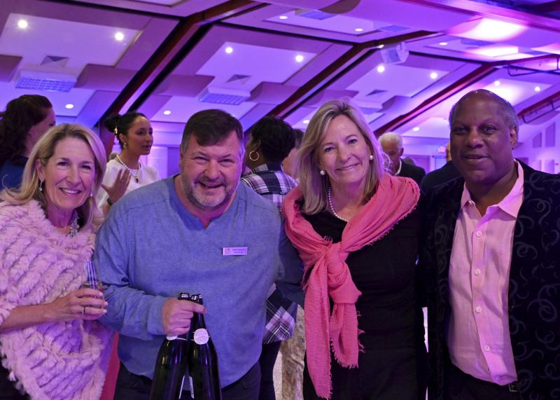 Making sure the party refreshments keep flowing are (l-r) Betsi Fakler, Mike Venanzi, Nancy Mayott, and Tom Johnson.