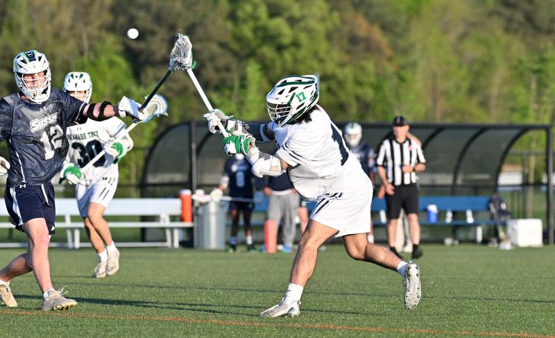 Del Tech midfielder Gabe Smith (Sussex Central) shoots and scores one of his nine goals in the game.
