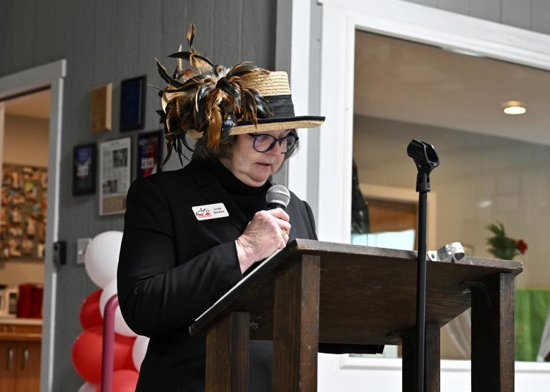 Linda Berdine, chair of the Kentucky Derby Day event and SDTR board member, serves as emcee for the first half of the night.